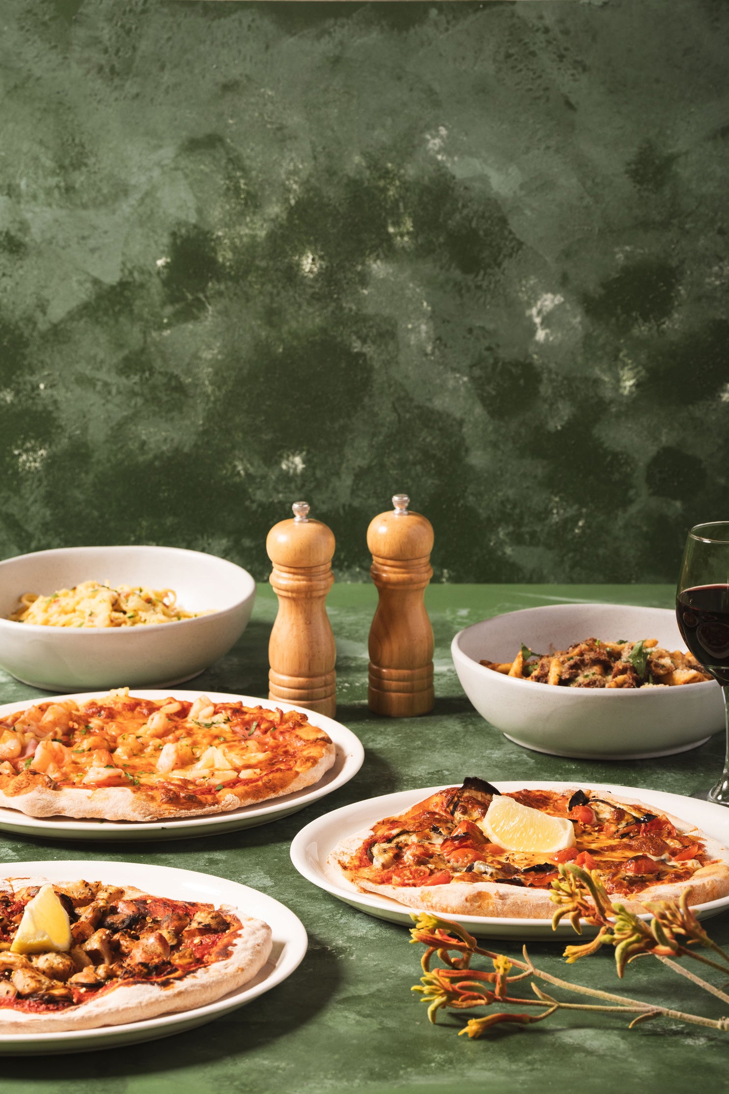 Wood-fired pizzas, garlic bread and a glass of red wine at the Parkwood Village bistro
