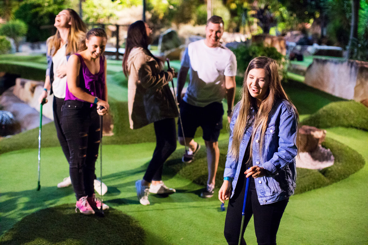 Family playing mini golf at Boulders & Badlands, Gold Coast